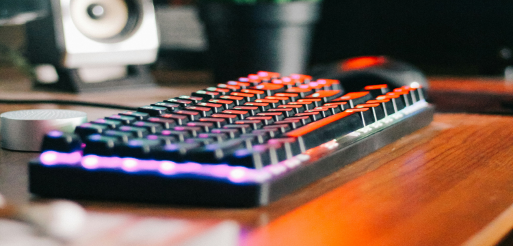 Keyboard and hands demonstrating WASD key position